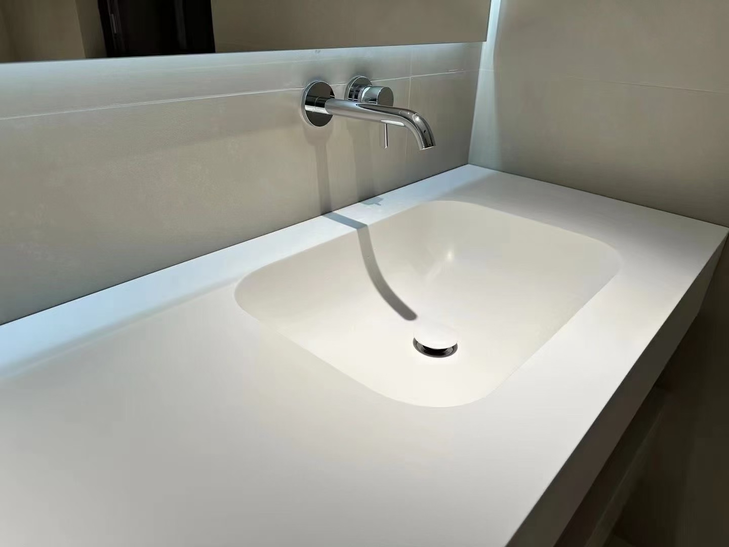 White Corian solid surface integrated basin for old bathroom renovation in Singapore
