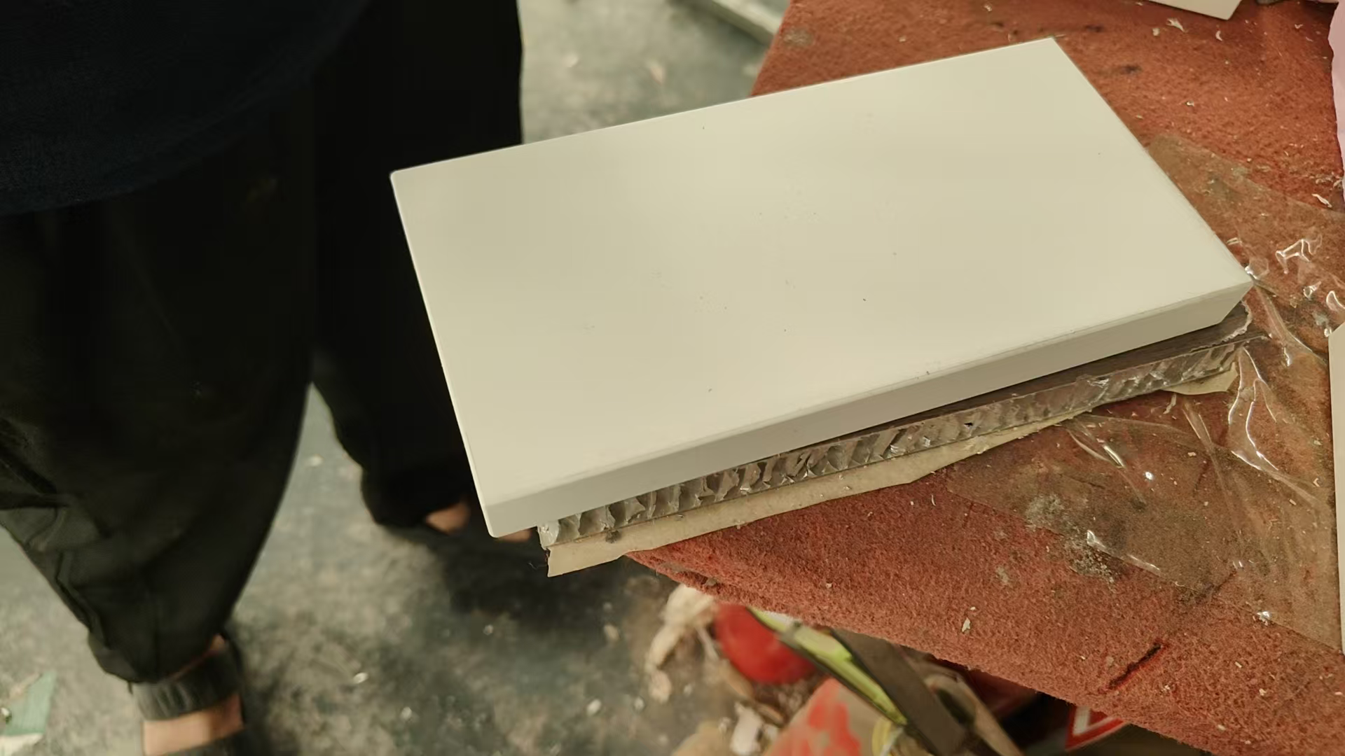 Cross-section of hollow aluminium honeycomb kitchen cabinet showing empty core structure