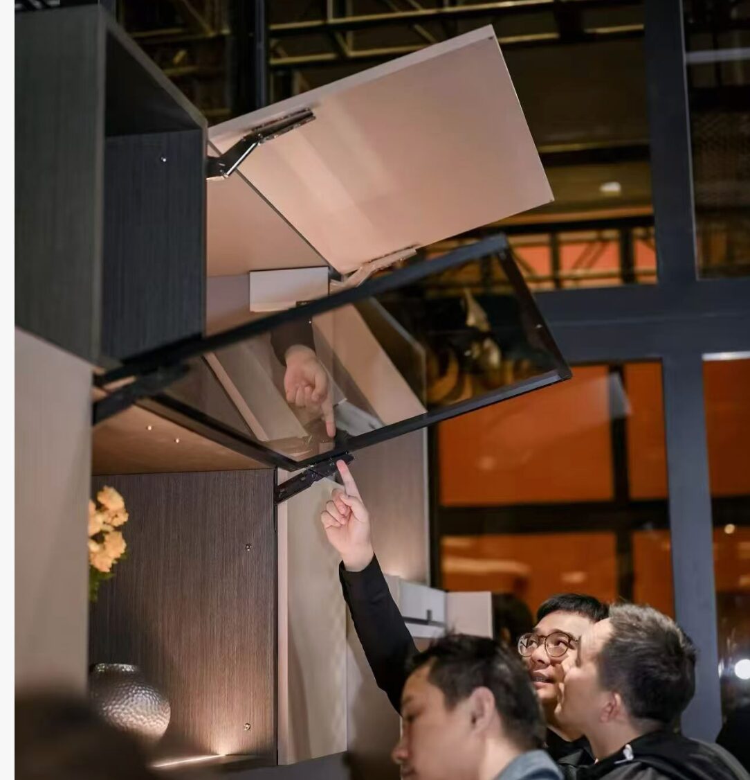 BLUM hardware system demonstrated at showroom — premium motion quality for Singapore custom carpentry